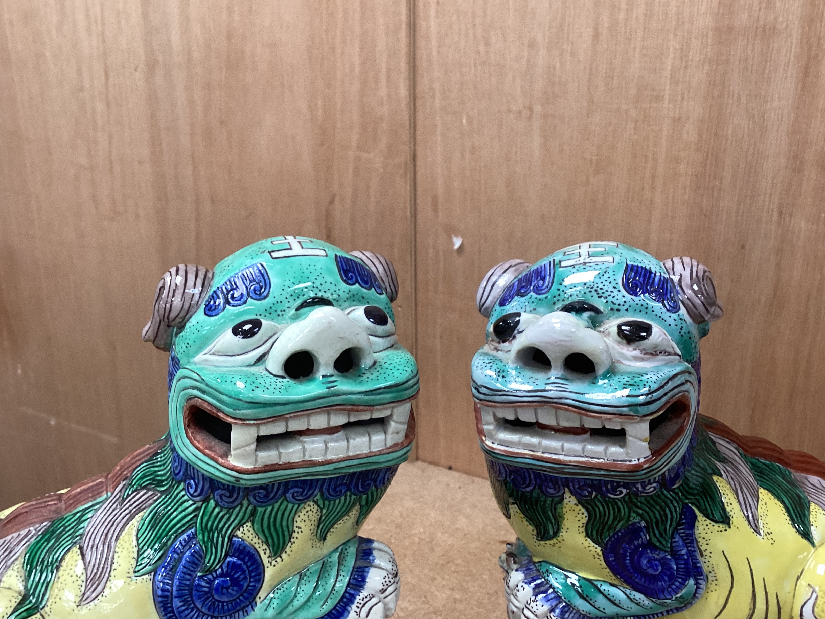 A pair of large 20th century Chinese or Samson enamelled porcelain figures of Buddhist Lions, 24cm